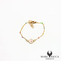 Bracelet en acier œil de Sainte Lucie et perles de résines