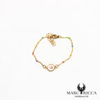 Bracelet en acier œil de Sainte Lucie et perles de résines