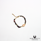 Bracelet perles de verre et œil de Sainte Lucie en acier doré