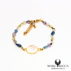 Bracelet perles de verre et œil de Sainte Lucie en acier doré