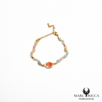 Bracelet perles de verre et œil de Sainte Lucie en acier doré